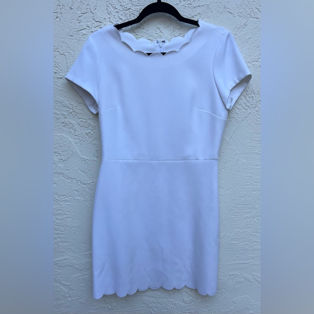 Adorable white dress 🤍 very elegant and modest with detailing around neck line